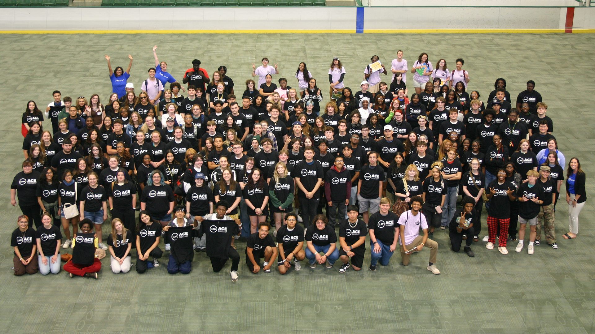 Group of SUNY Oswego ACE students wearing black and white ACE t-shirts