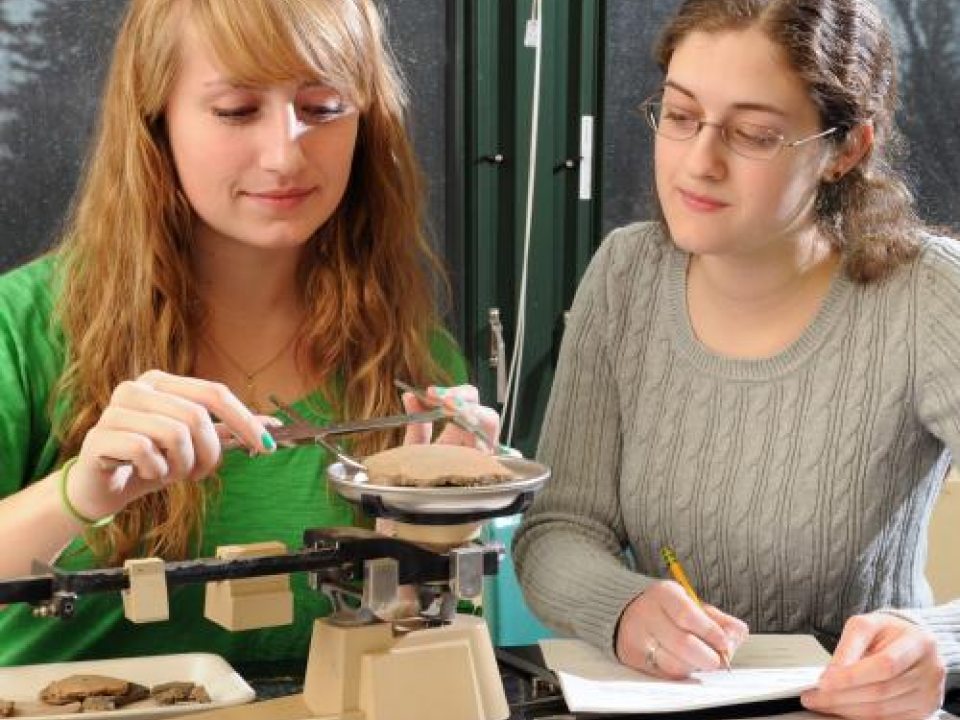 Two female students in an anthropology lab