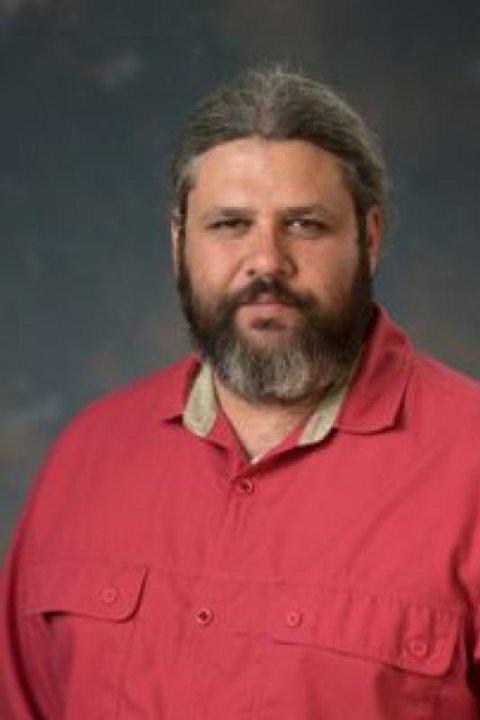 Headshot of a man with a beard.