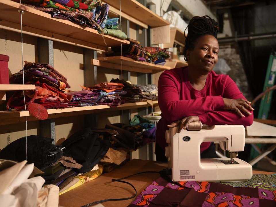Ellen Blalock with fabric and sewing machine