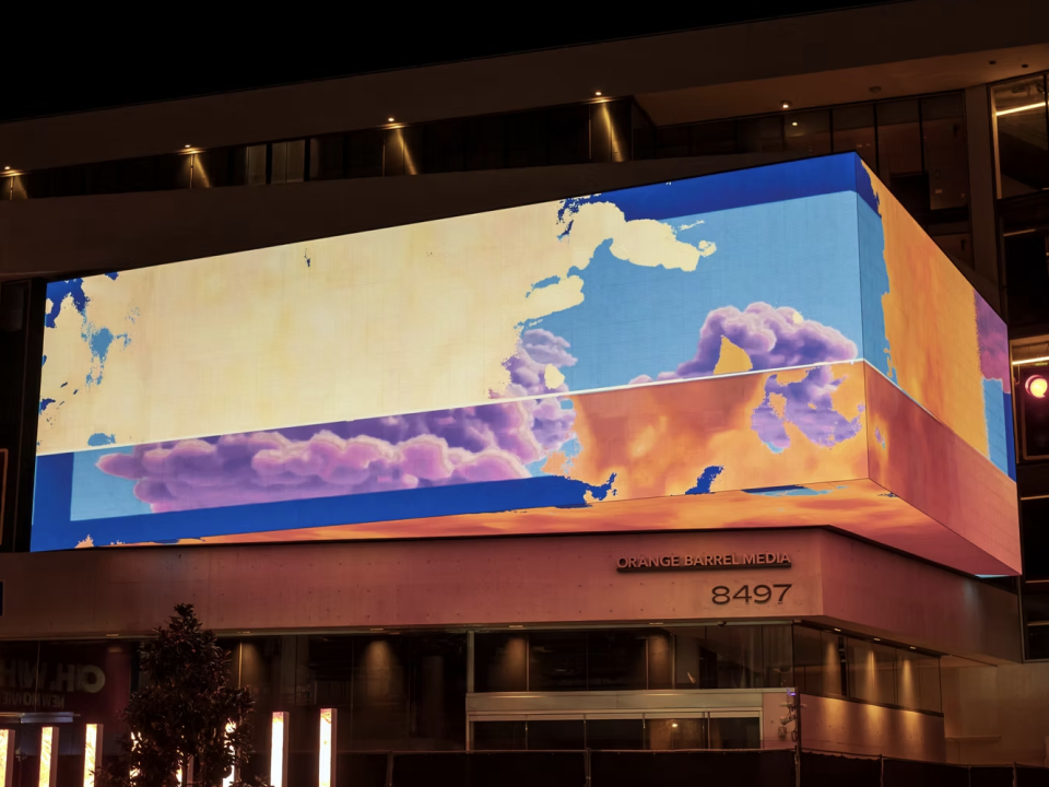 A photo of an animation created by Isabel Beavers projected on a building.