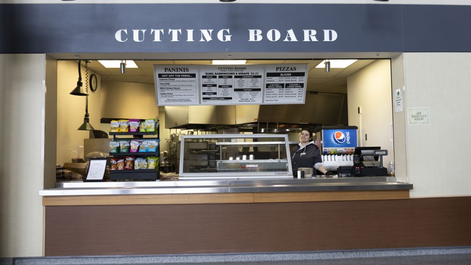 Cutting Boatrd Location with a student at the cash register 