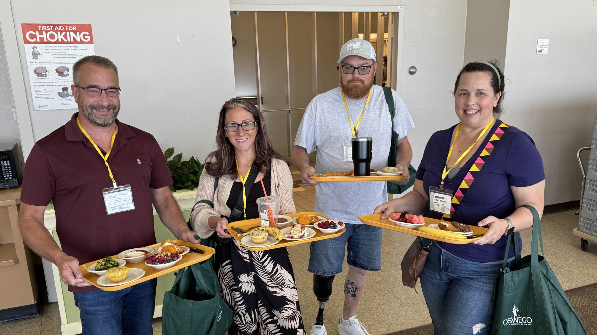 Four parents holding their trays in Cooper