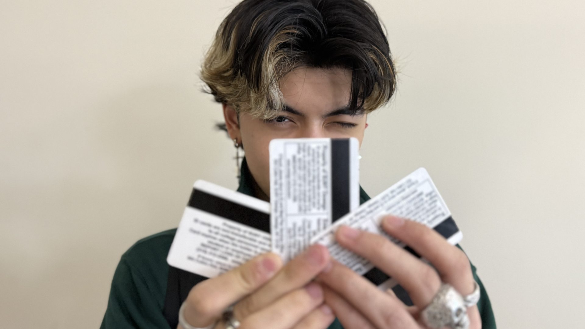 Student holding ID cards