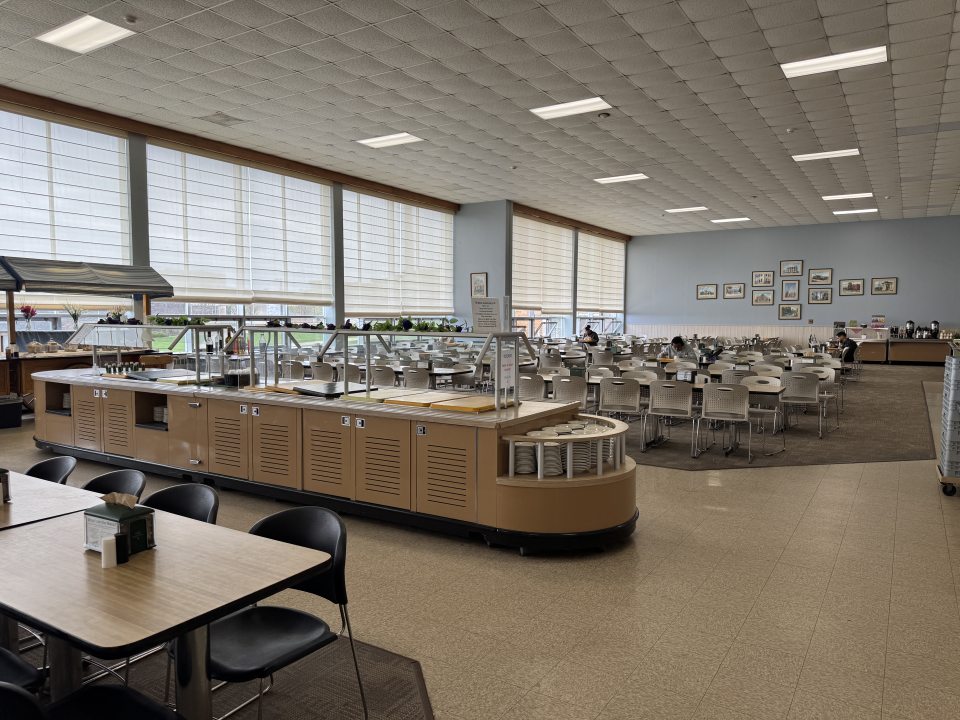 Cooper dining hall, with booths and tables with chairs. 