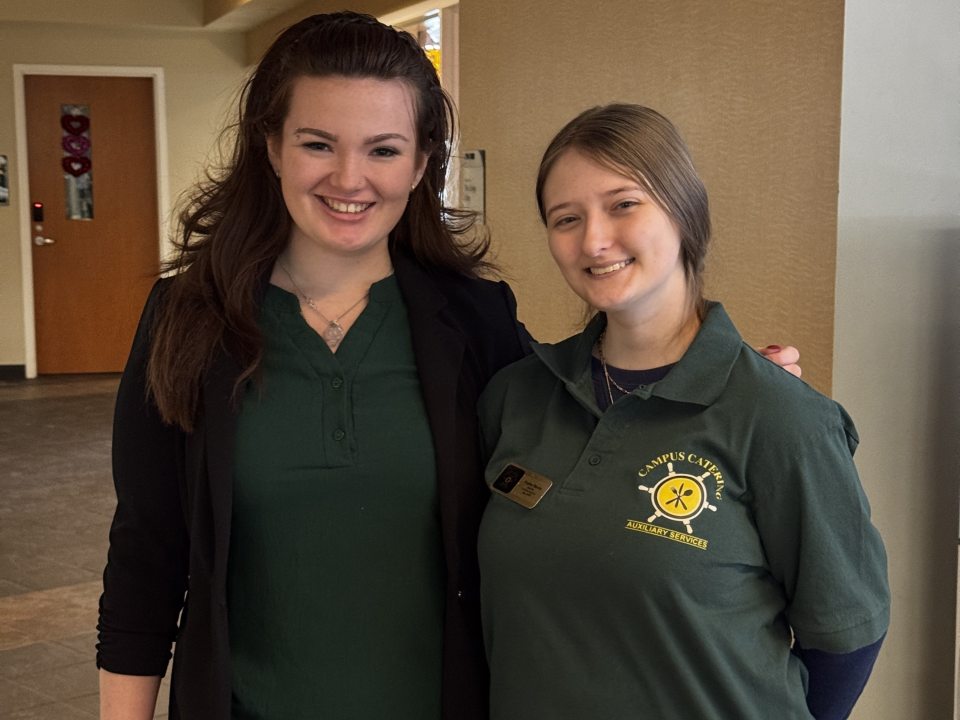 Two students workers in their uniforms. 