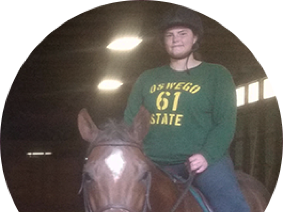 Biological Science student riding a horse