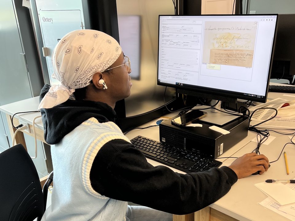 A student digitizing plant specimens