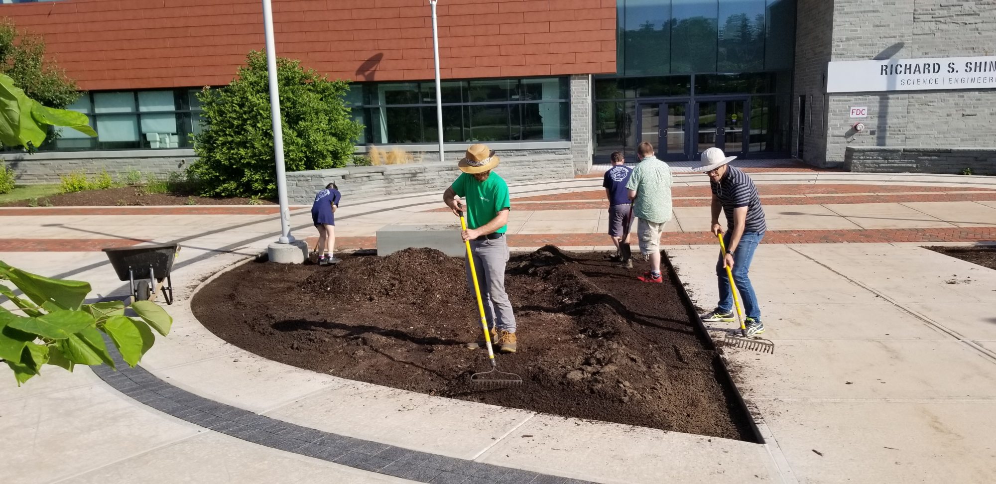 People preparing the Alvar garden beds