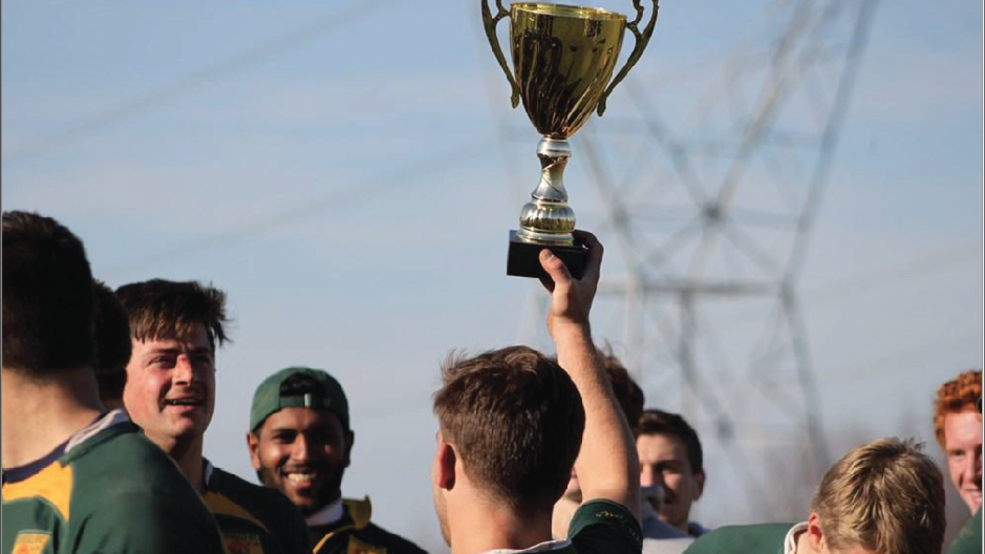 rugby holding trophy