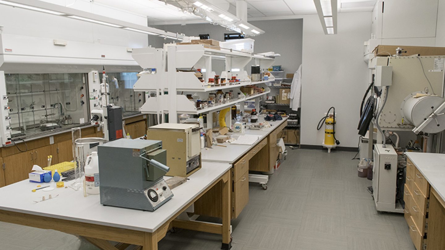 A well-equipped inorganic research laboratory with benches and instrumentation.