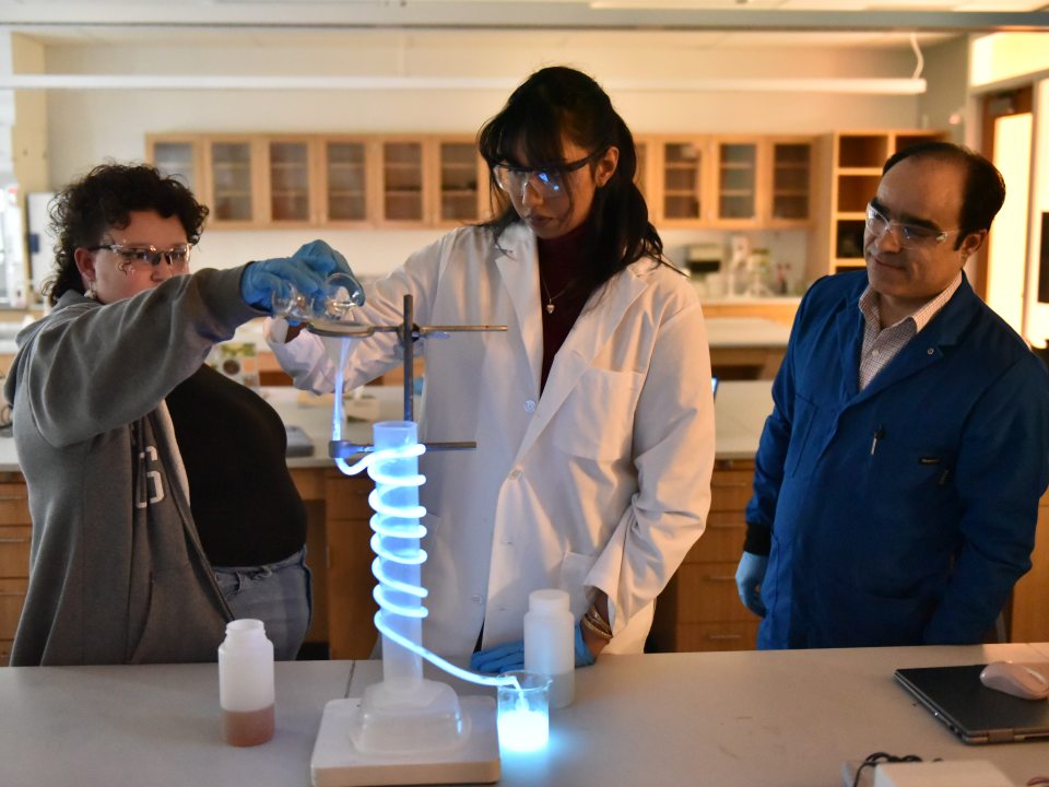 Three people in a lab
