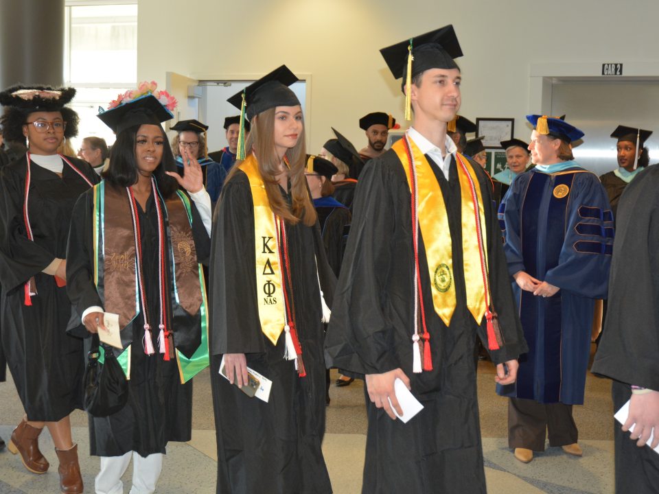 Graduates waiting in line to cross the stage