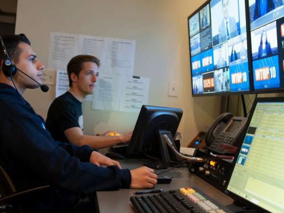Broadcasting students in studio room 