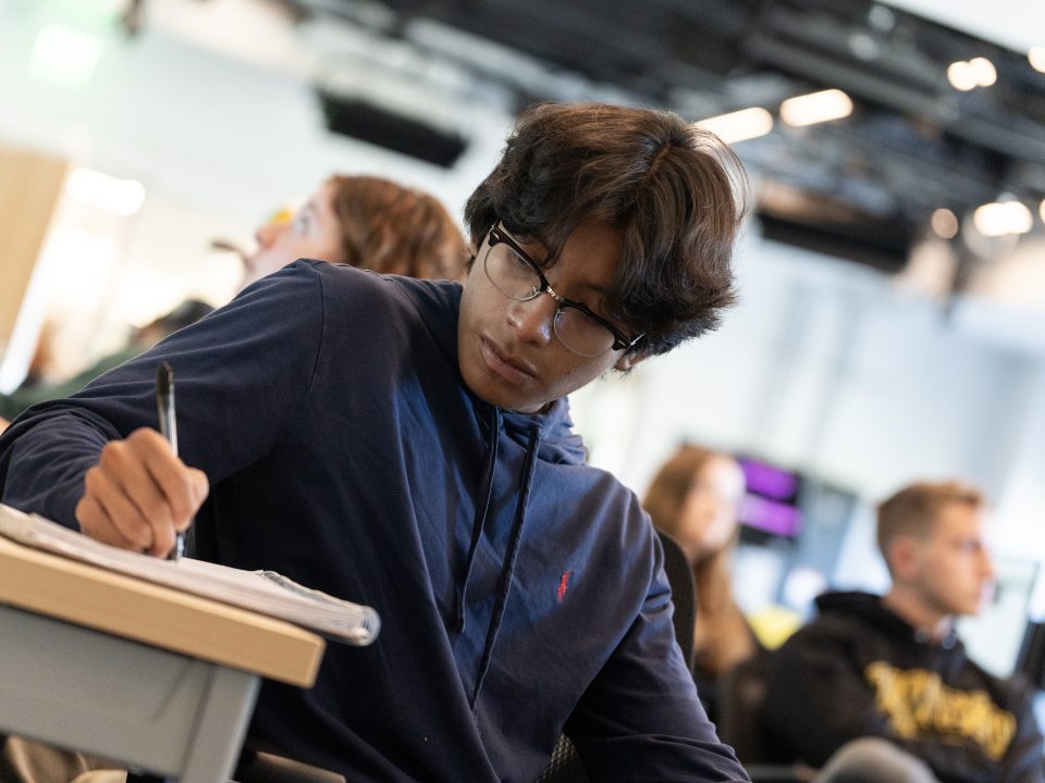 Student taking notes