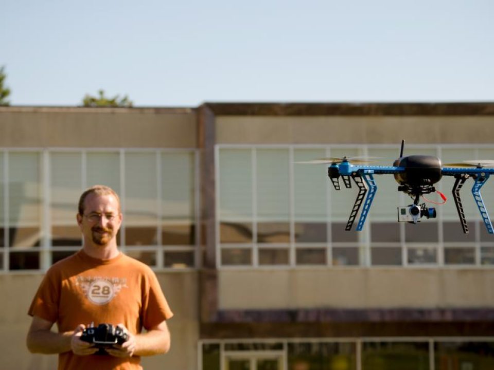 HCI student Phillip Moore controlling a drone