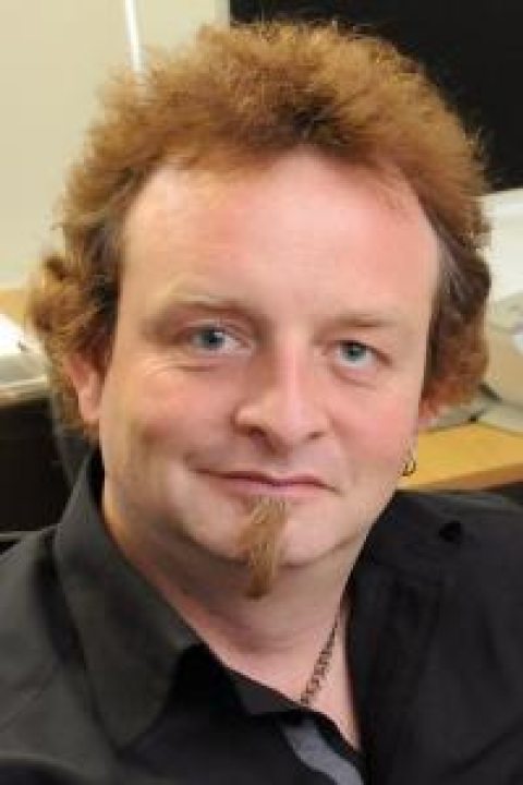headshot of Damian Schofield