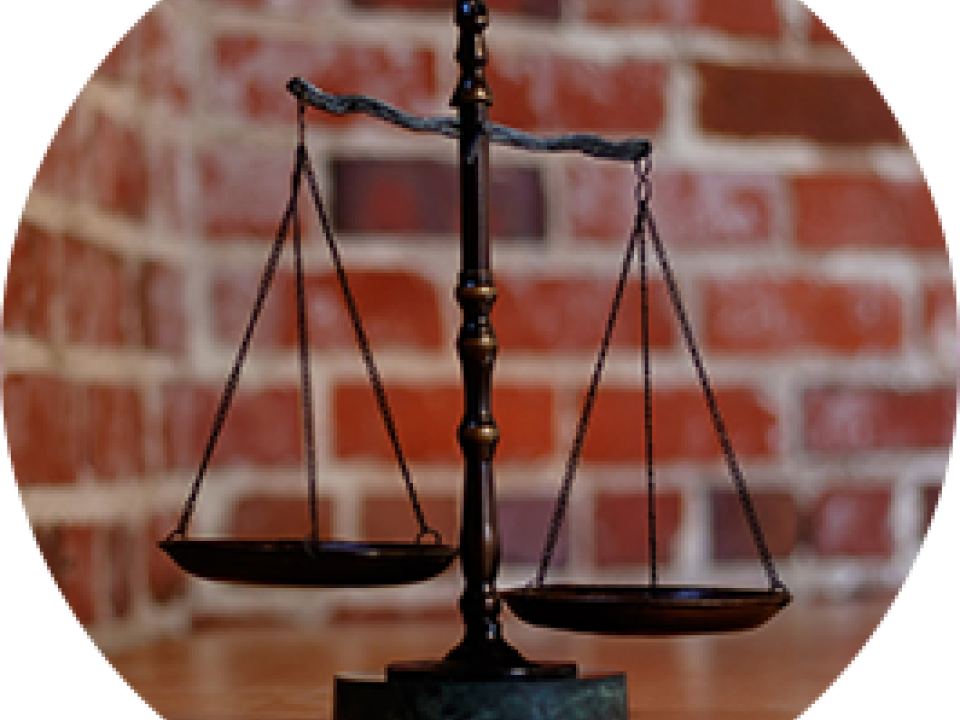 balance scale with brick background