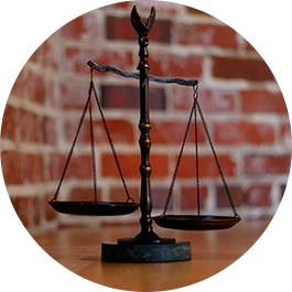 balance scale with brick background