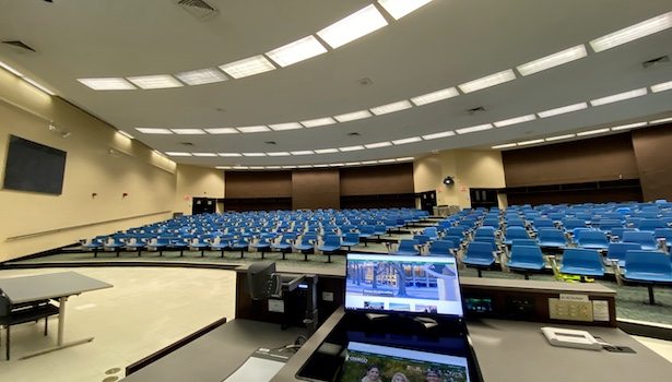 Photo from the podium showing the front/left of the classroom. Including seats and monitors.