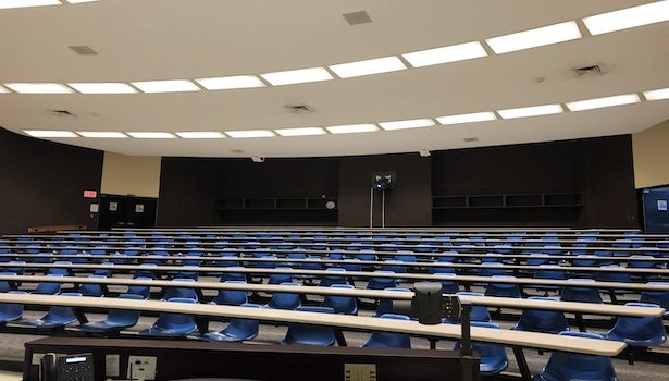 This photo shows the seats in the room from the podium perspective. Including the projector in the back of the classroom.