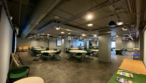 Photo shows the front of the room from the back left.