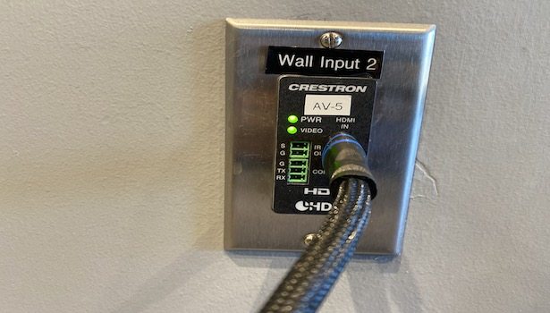 Photo shows the wall panel to plug the HDMI Cable for Laptop in (Shown with HDMI Cable plugged in).