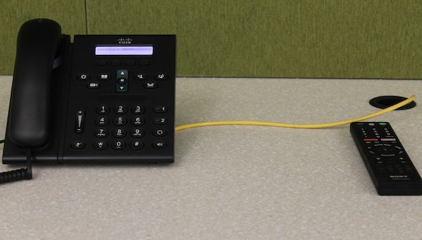 Photo of the phone in the room as well as the television remote.