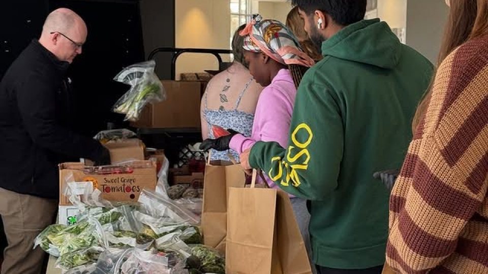 Students line-up for Fresh Produce Giveaway. 