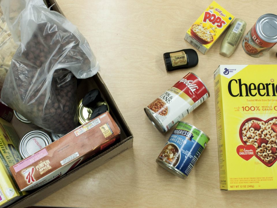 A box of Cheerios, cans of soup and other food items that can be found in SHOP