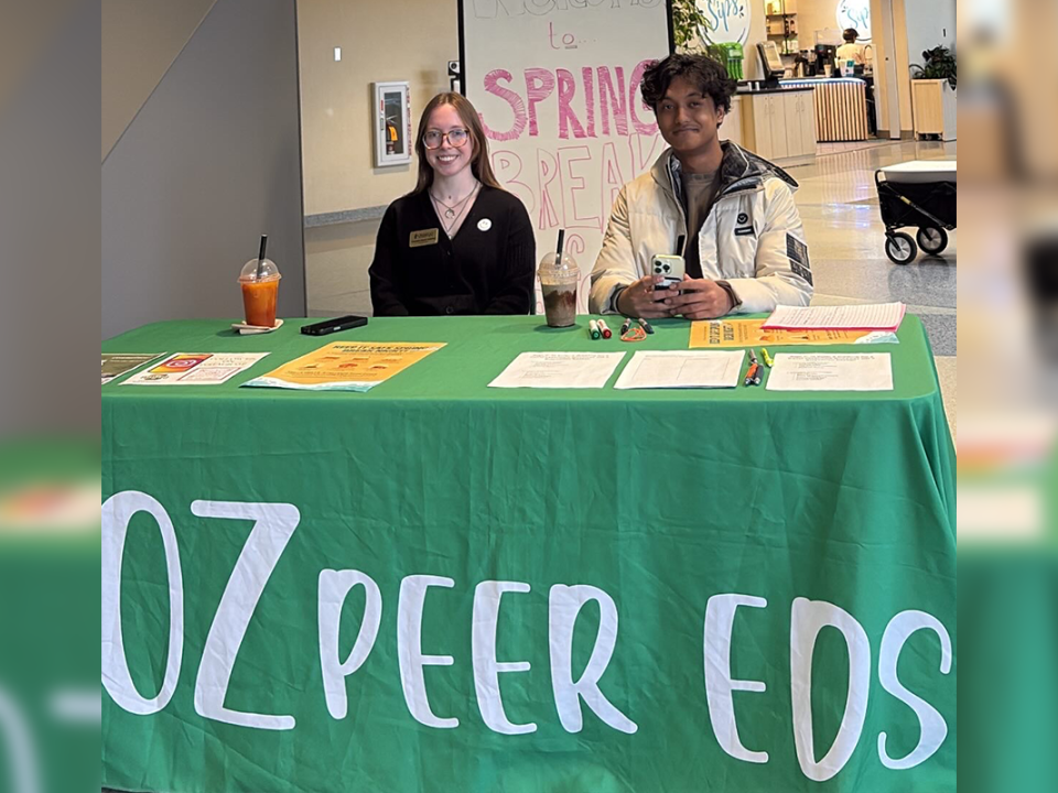 Two Oz Peer Eds tabling at their Safe Spring Break tabling
