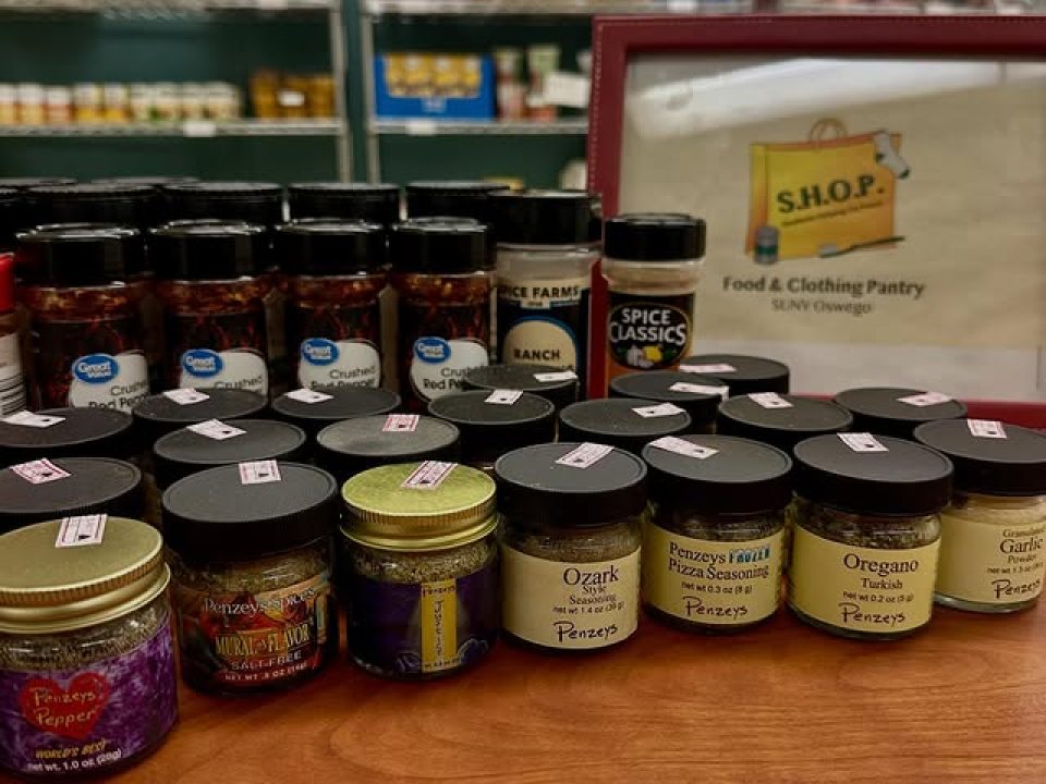 A variety of spices displayed on a table. 