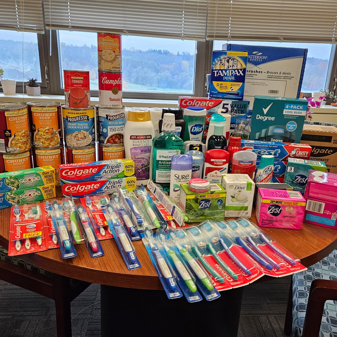 Generous donations from the Office of the Dean of Students to the Food Pantry, featuring canned goods, dental supplies, toiletries, and more.