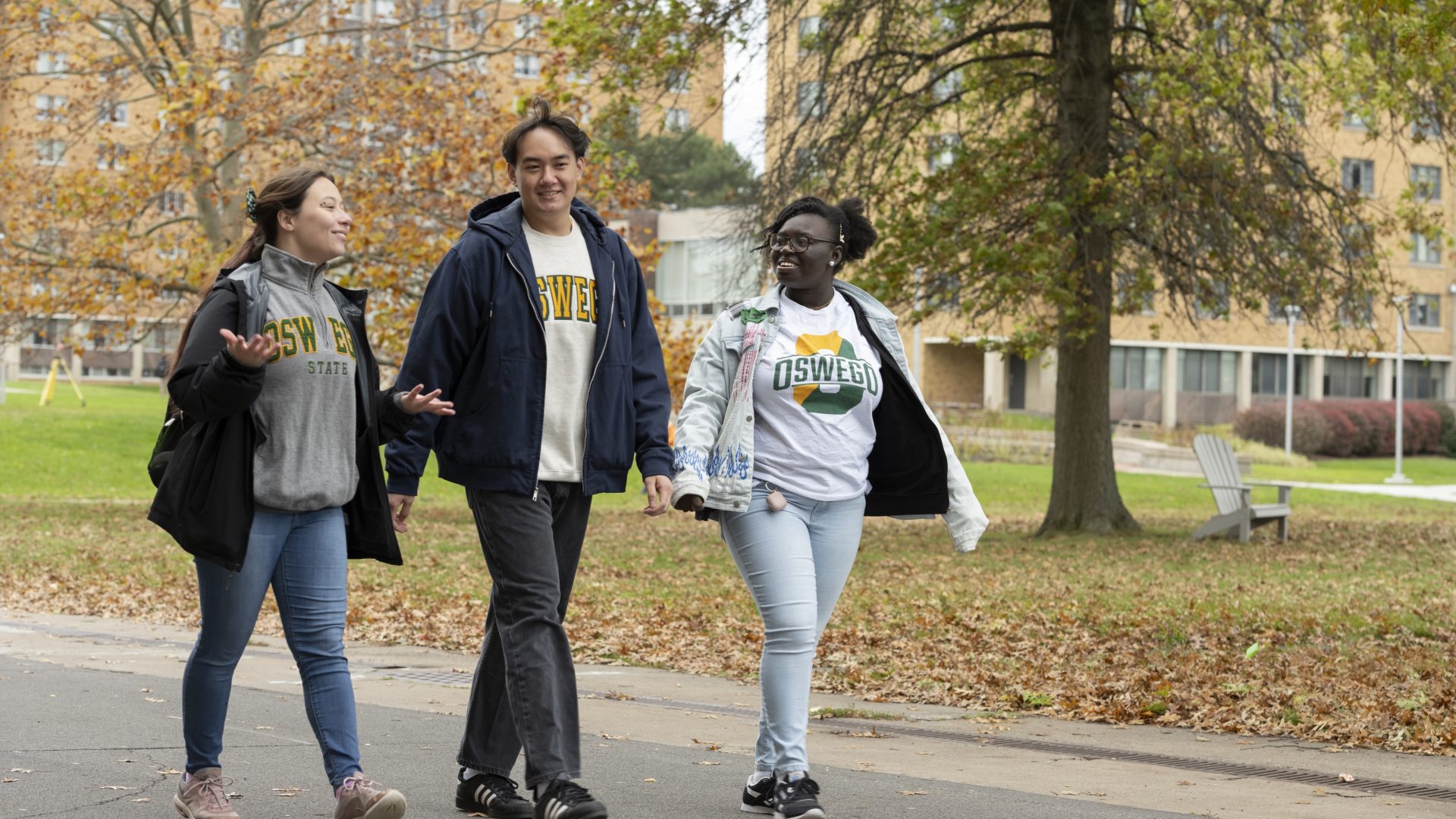 Three students walking together on campus
