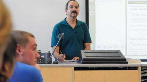 Dr. Dighe in a classroom