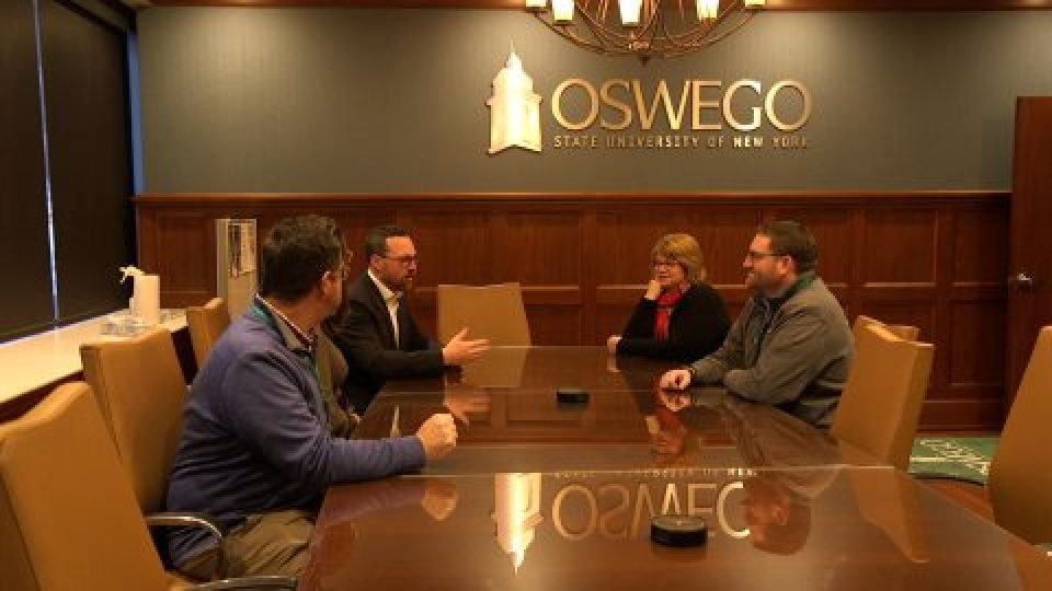 A group of executives at a conference table