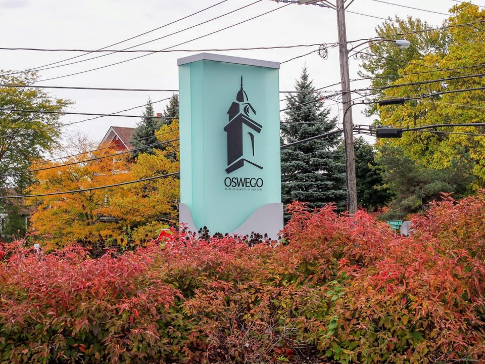 Pillar with Sheldon Hall&#039;s cupola at an entrance to the SUNY Oswego campus