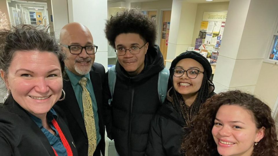 Professor, guest poet, and three students