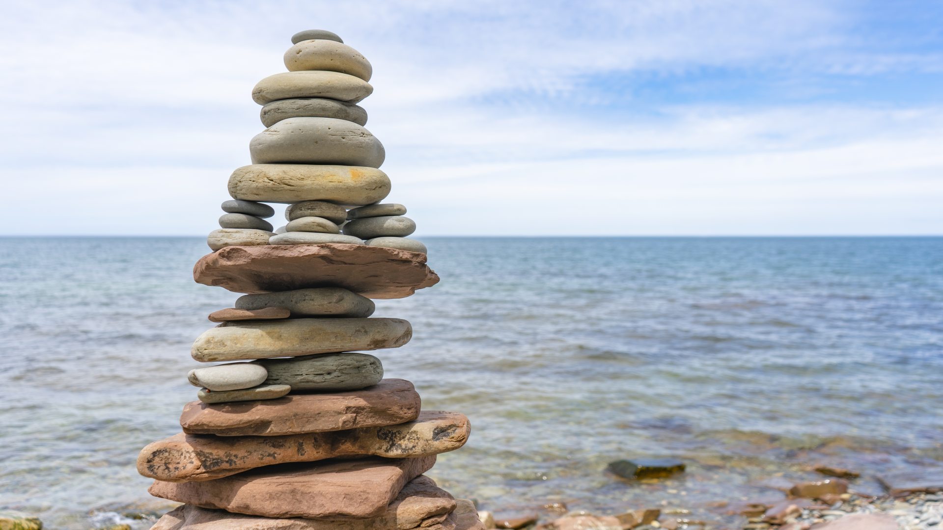 stacked rocks on lakeshore