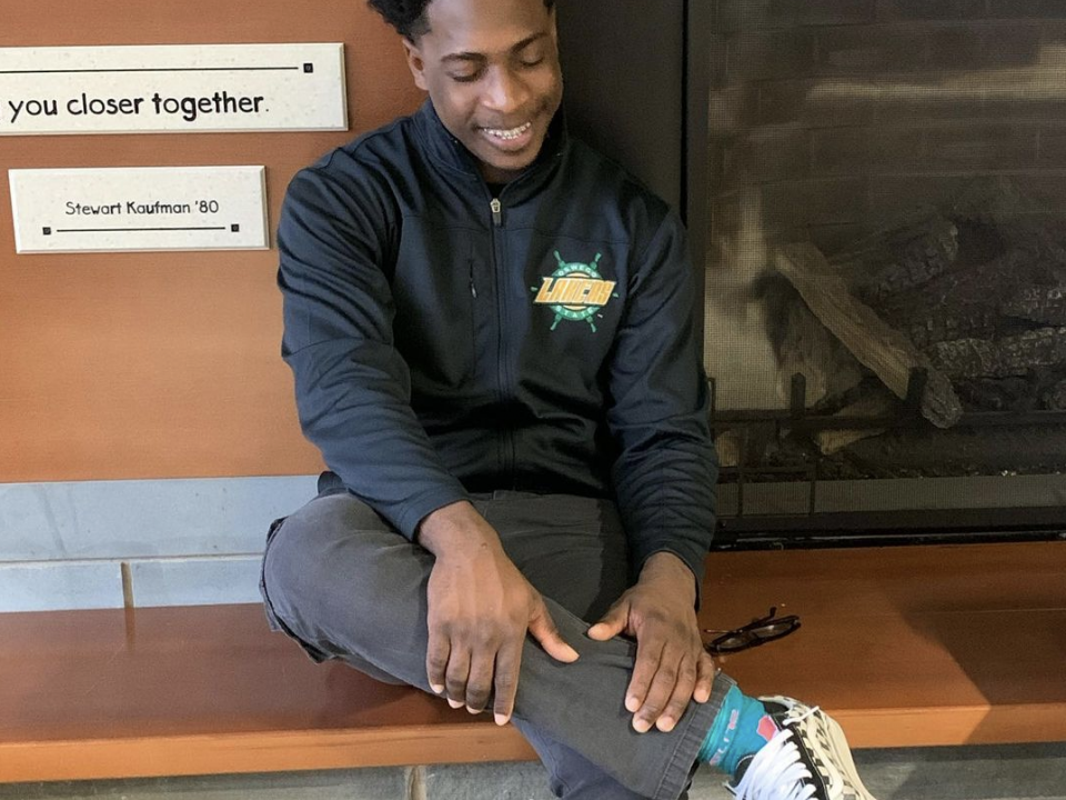 student sitting in hearth lounge