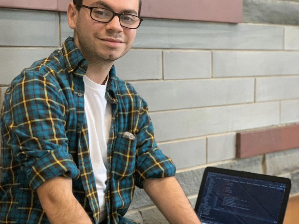 student with computer