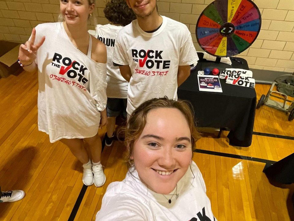 3 students wearing &quot;rock the vote&quot; t-shirts