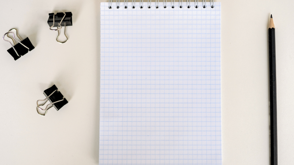 three binder clips, one spiral notebook with grid paper, one pencil
