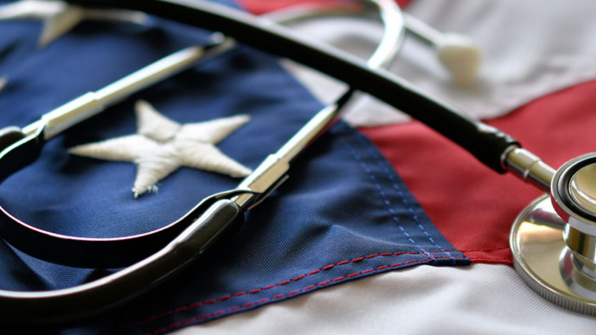 A stethoscope on top of an American flag