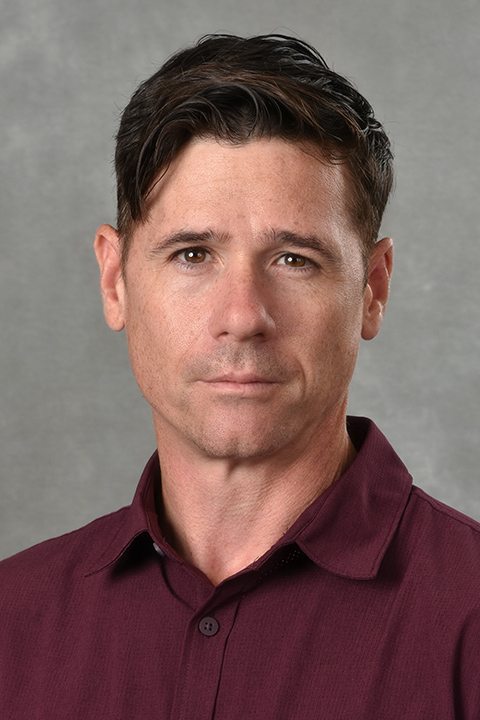 Michael Donnan Headshot against a grey background