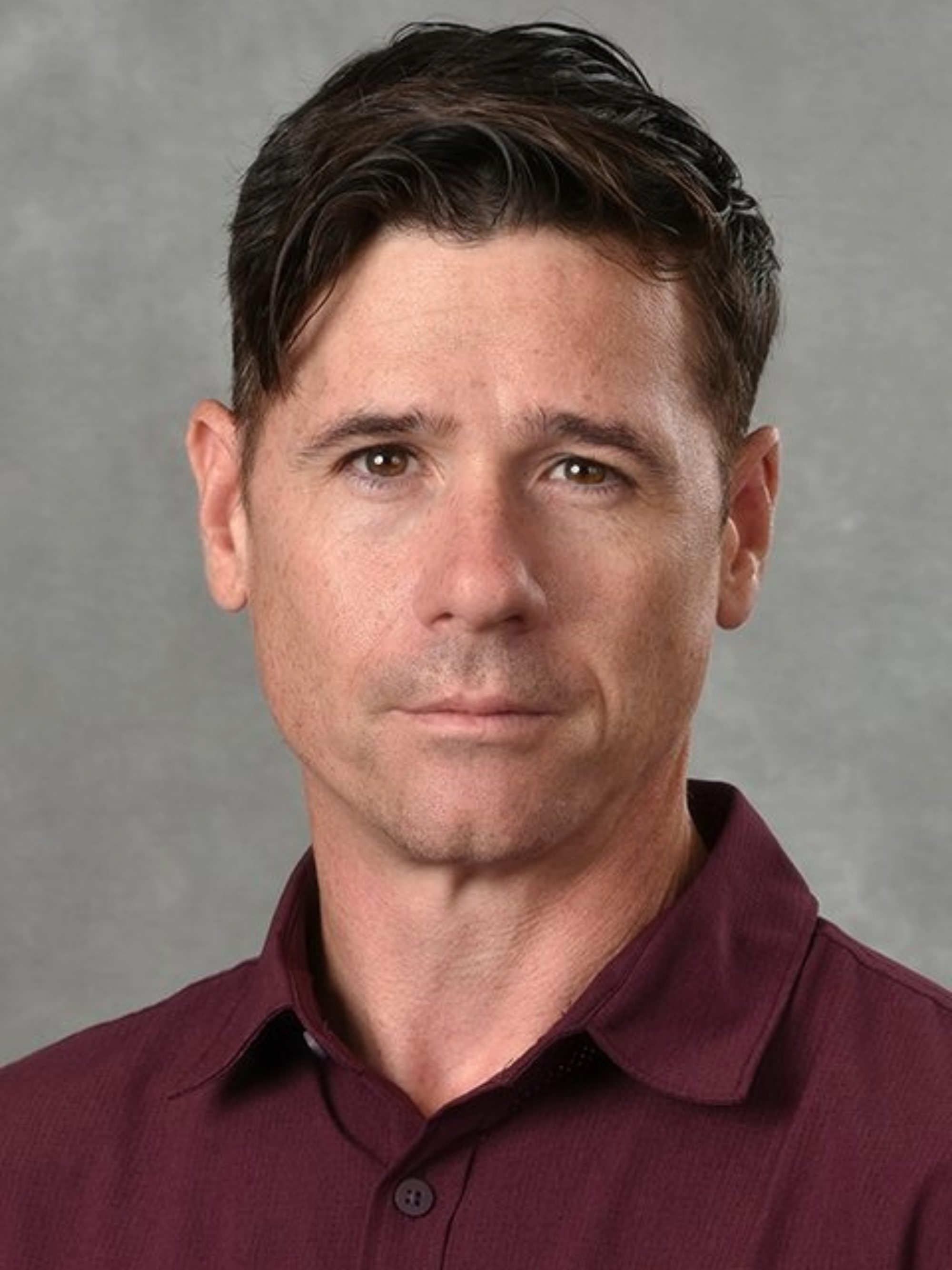 Michael Donnan&#039;s headshot against a gray background