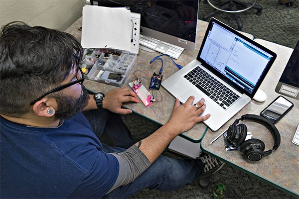 man sitting at computer