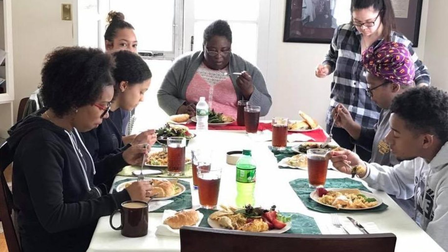 people eating at a dinner table