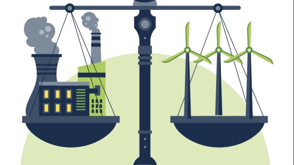 Drawing of a scale showing a Nuclear Plant and Steam Station on left of the scale On the right scale a wind mill represent types of fuels.
