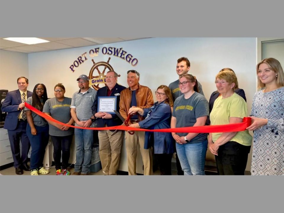 SUNY Oswego students and Port of Oswego Authority representatives at the ribbon-cutting ceremony for the new grain testing laboratory.